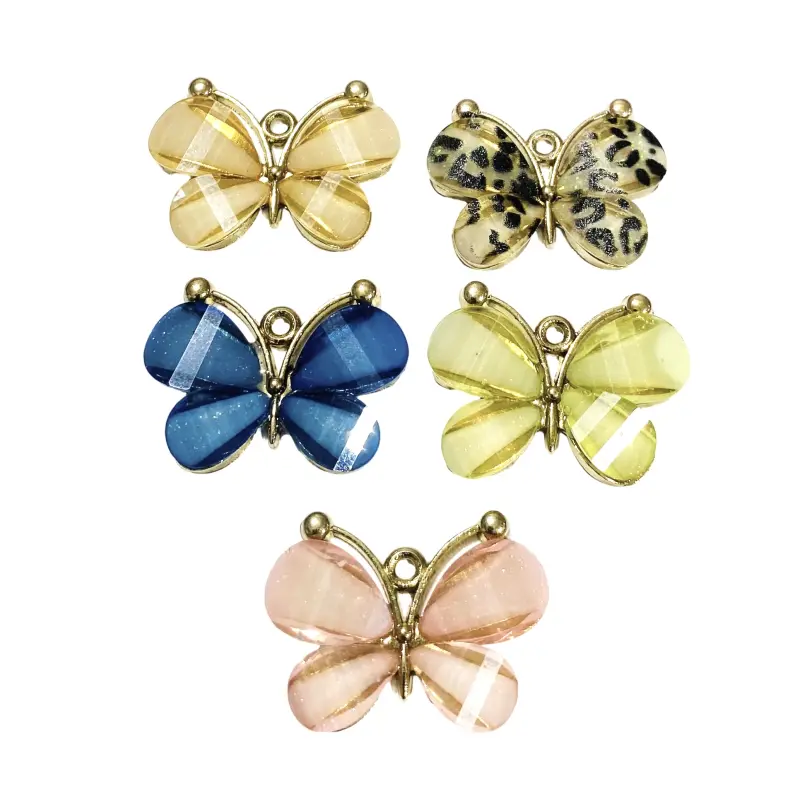 Pingente Borboleta de Metal com Strass 2,2cm X 3cm Marfim com Pintas Pretas